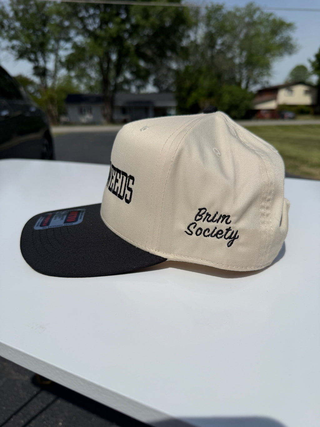 “In the weeds” cap